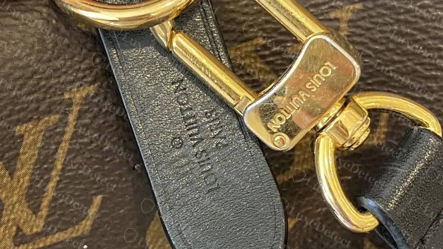 Genuine Neonoe strap tab and clip: the tab is stamped LOUIS VUITTON PARIS and the brass clip is engraved LOUIS VUITTON