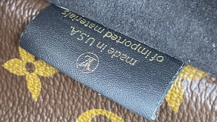 Genuine US-made Neonoe tag: black leather reading made in U.S.A. of imported materials above the LV mark