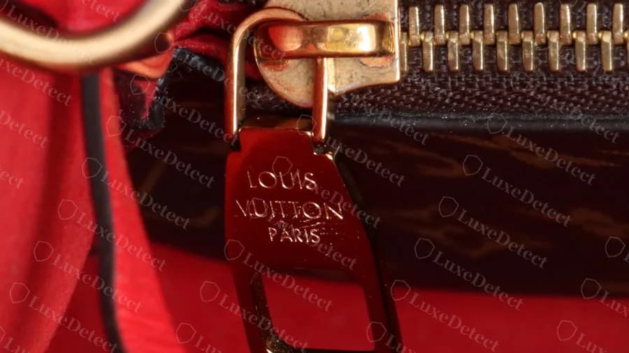 Genuine Neonoe inside zip pull on a red-lined bag, the same three lines LOUIS VUITTON PARIS
