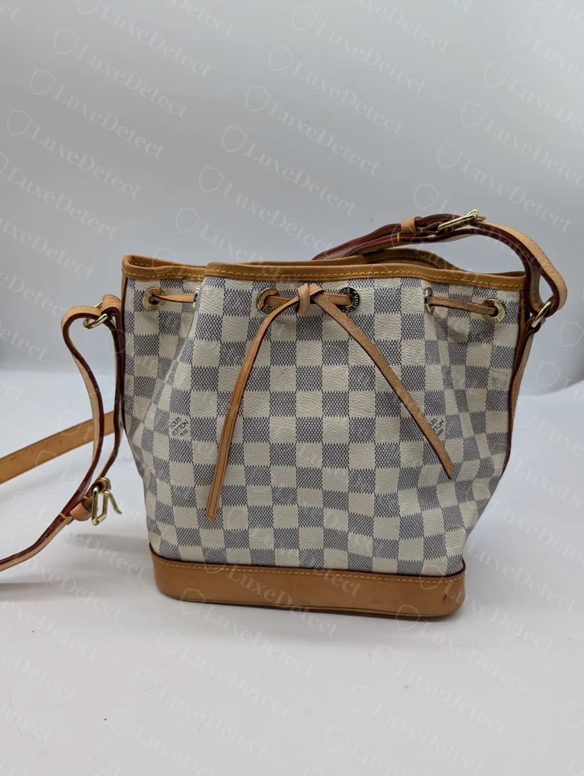 A confirmed fake Noé BB in Damier Azur canvas. The overall silhouette and checkerboard pattern look convincing at listing distance, which is exactly why this guide leads with hardware close-ups instead.