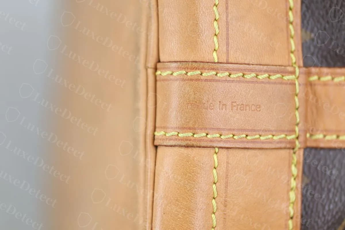 Authentic Noé heat stamp, evenly spaced lettering with a clean gap between "LOUIS VUITTON PARIS" and "made in France."