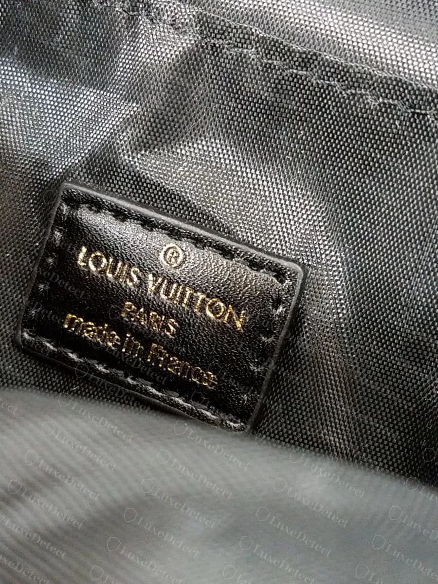 Counterfeit Reverse Palm Springs Mini interior patch: LOUIS VUITTON PARIS made in France filled with gold foil, on a shiny grey nylon lining