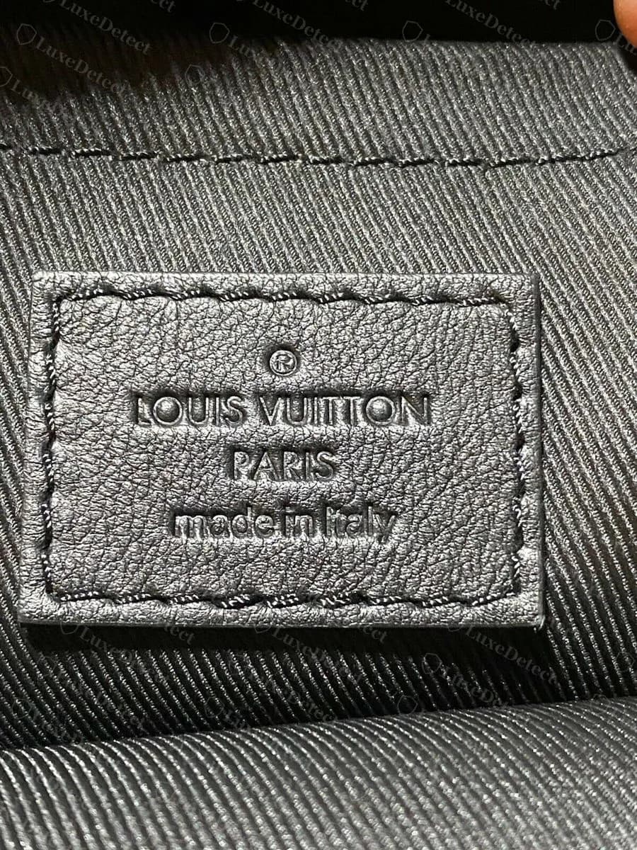 Genuine Palm Springs MM interior patch: blind-debossed LOUIS VUITTON, PARIS, made in Italy, thin even letters with no colour fill, on a twill lining