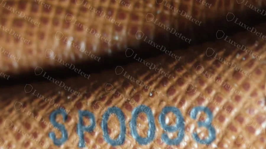 Genuine Papillon date code SP0093 stamped in blue ink into the lining