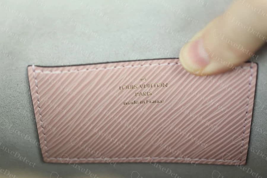 Authentic interior stamp on a Twist bag — "LOUIS VUITTON PARIS made in France" correctly spaced and debossed into Epi-grained leather