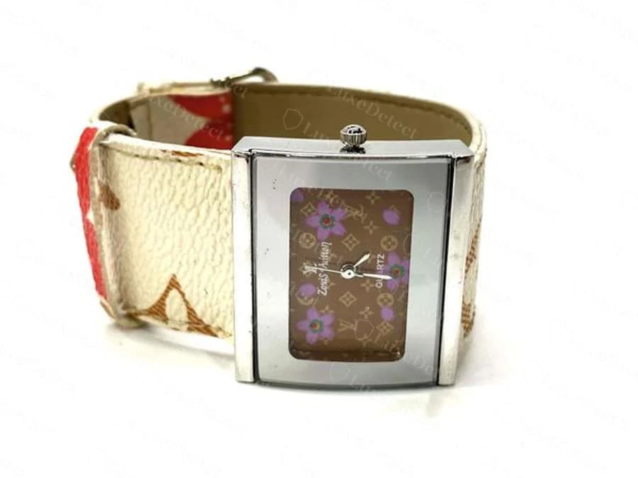 Counterfeit Louis Vuitton monogram-flower watch dial reading "Zouis Vuitton," the script capital L cast as a distorted Z-shaped glyph