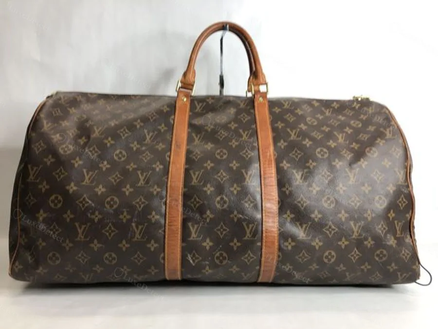 A well-made counterfeit Keepall from our archive in Monogram canvas — the overall silhouette and pattern application look close to genuine, which is why canvas alone should not be the deciding check