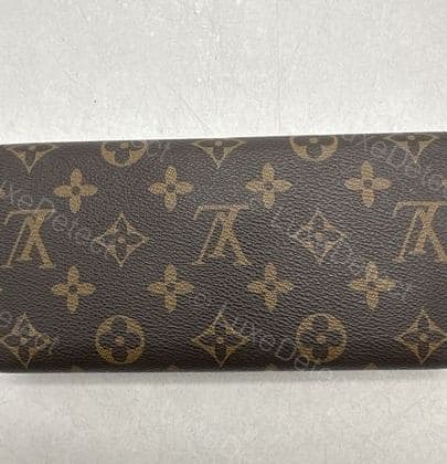 Counterfeit LV monogram canvas — compare the tone against the genuine reference: flatter and cooler, with less warmth in the brown