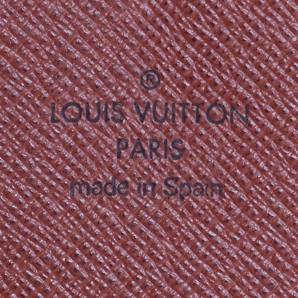 Genuine LV interior stamp — "LOUIS VUITTON PARIS" and "made in Spain," even depth, generous letter spacing, near-circular O characters