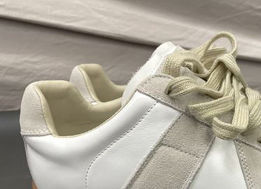 Counterfeit Maison Margiela heel tab — the same size and placement of suede patch, but completely blank with no number grid, no circle, and no text