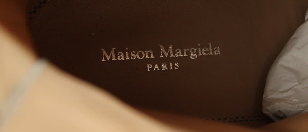 Genuine Maison Margiela insole — a gold-foil "Maison Margiela / PARIS" stamp cleanly hot-stamped into the leather footbed