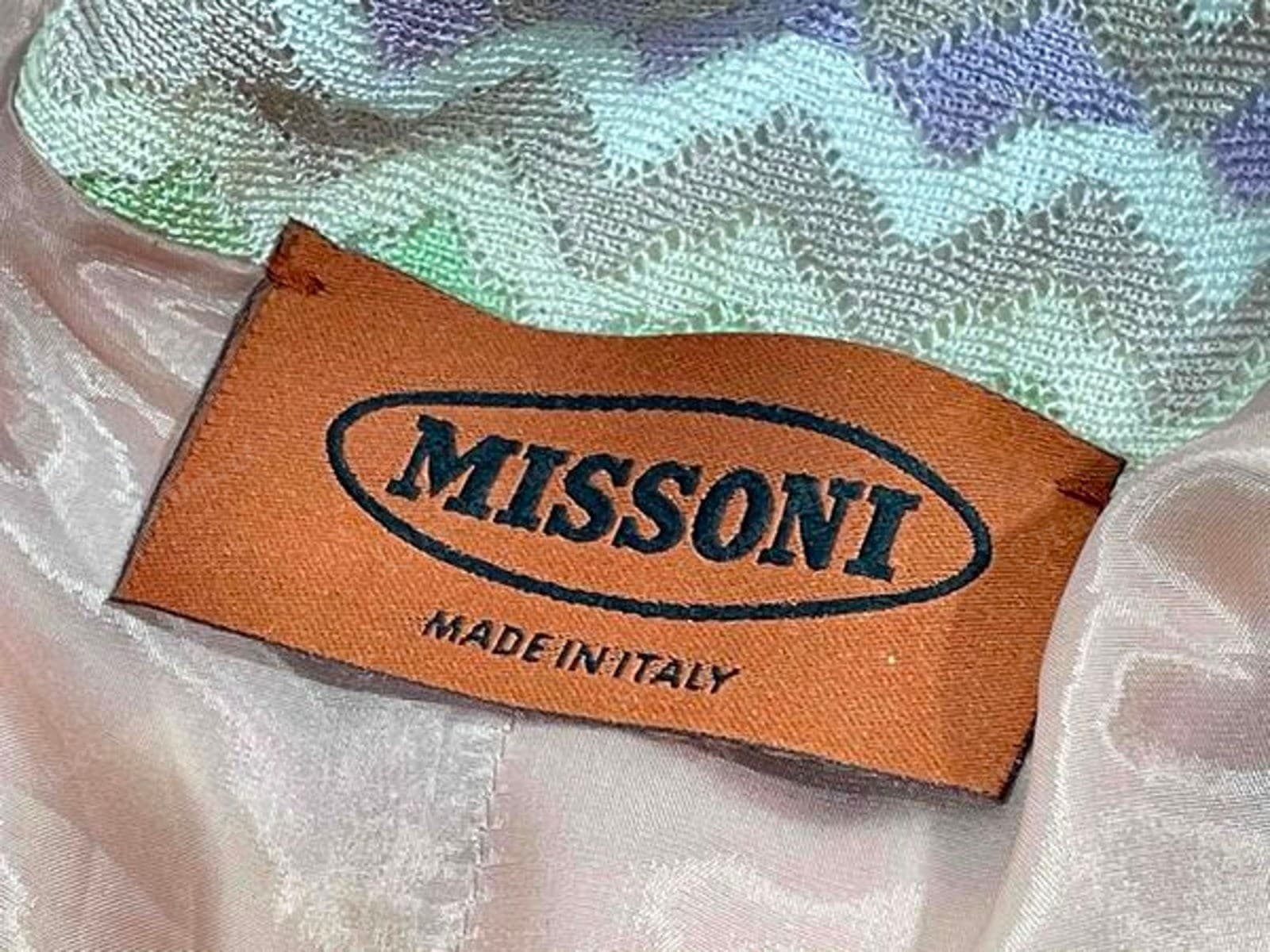 Genuine Missoni label — the "MISSONI" wordmark in the oval, cleanly woven in dark thread on a tan tab with "MADE IN ITALY" beneath, sewn into the zigzag knit above a pale lining