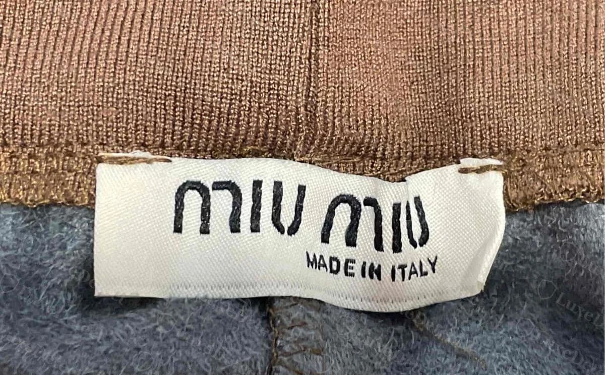 Counterfeit trousers with a convincing woven neck label. We could not separate labels like this from genuine ones by lettering alone.