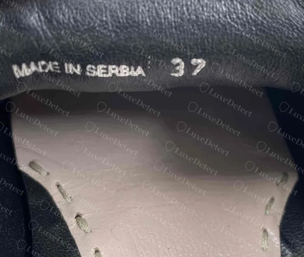 Counterfeit Miu Miu cap-toe slip-on heel lining reading only "MADE IN SERBIA 37", with no style code