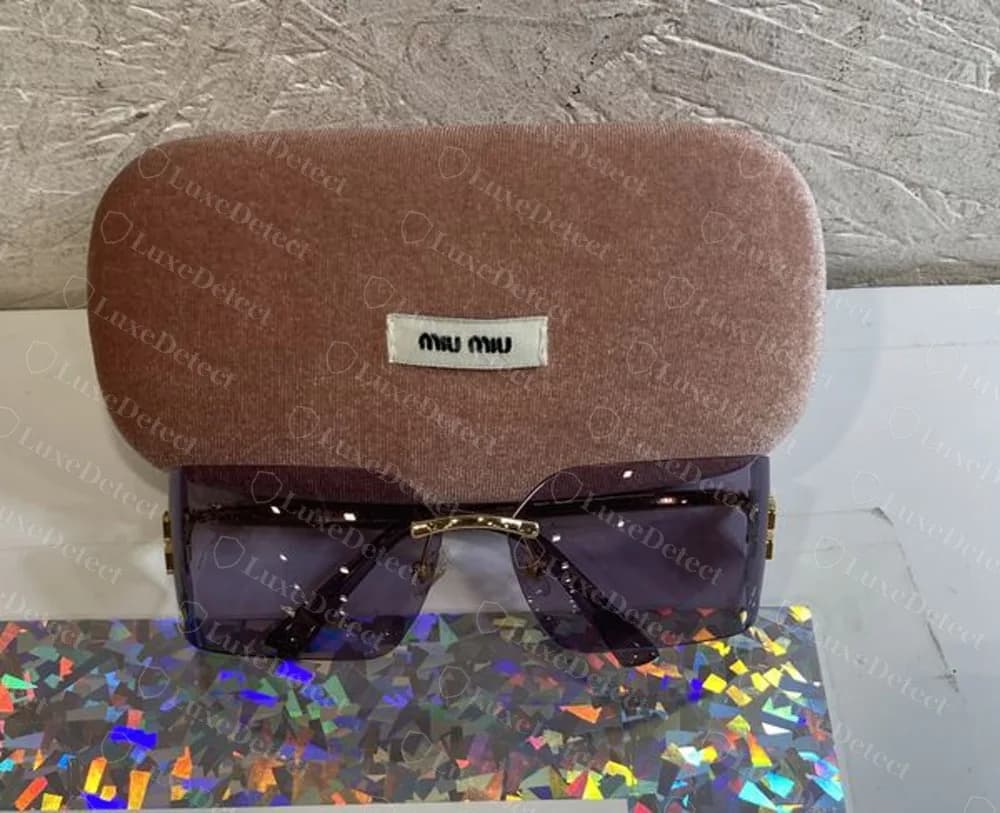 Counterfeit Miu Miu rimless sunglasses sold with a convincing pink velvet hard case and woven label
