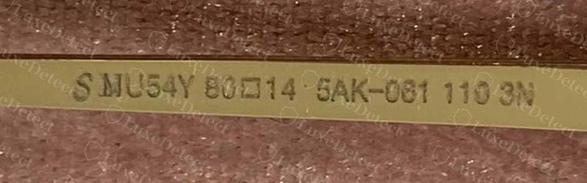 Counterfeit rimless Miu Miu temple with a copied code, "S MU54Y 80□14 5AK-061 110 3N"; note the stray gap after the S