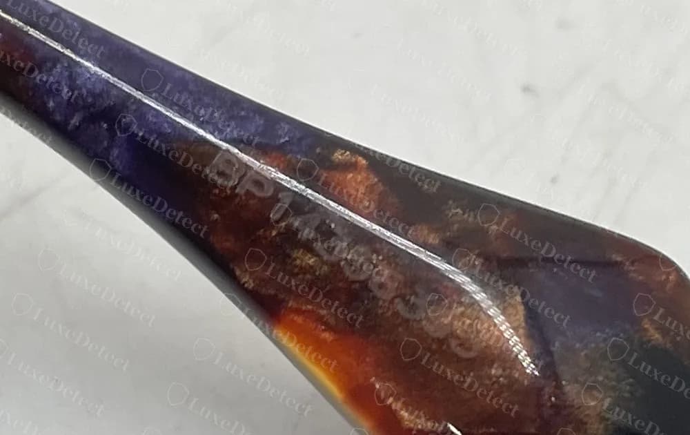 Counterfeit Miu Miu optical frame with a laser-etched serial beginning BP on the temple tip, showing that fakes copy this detail too