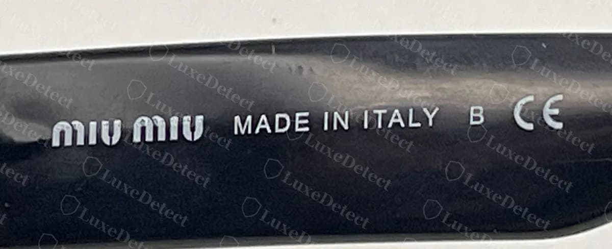 Authentic Miu Miu brand line reading "miu miu MADE IN ITALY B CE", with the factory letter B between the origin and the CE mark
