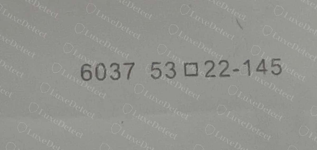 Counterfeit Miu Miu temple code reading "6037 53□22-145": a bare factory number with no Miu Miu model code, no colour code and no lens category