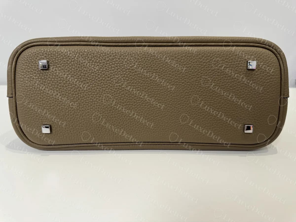 Genuine smaller Moynat Gabrielle base with four square studs, one at each corner and none in the centre
