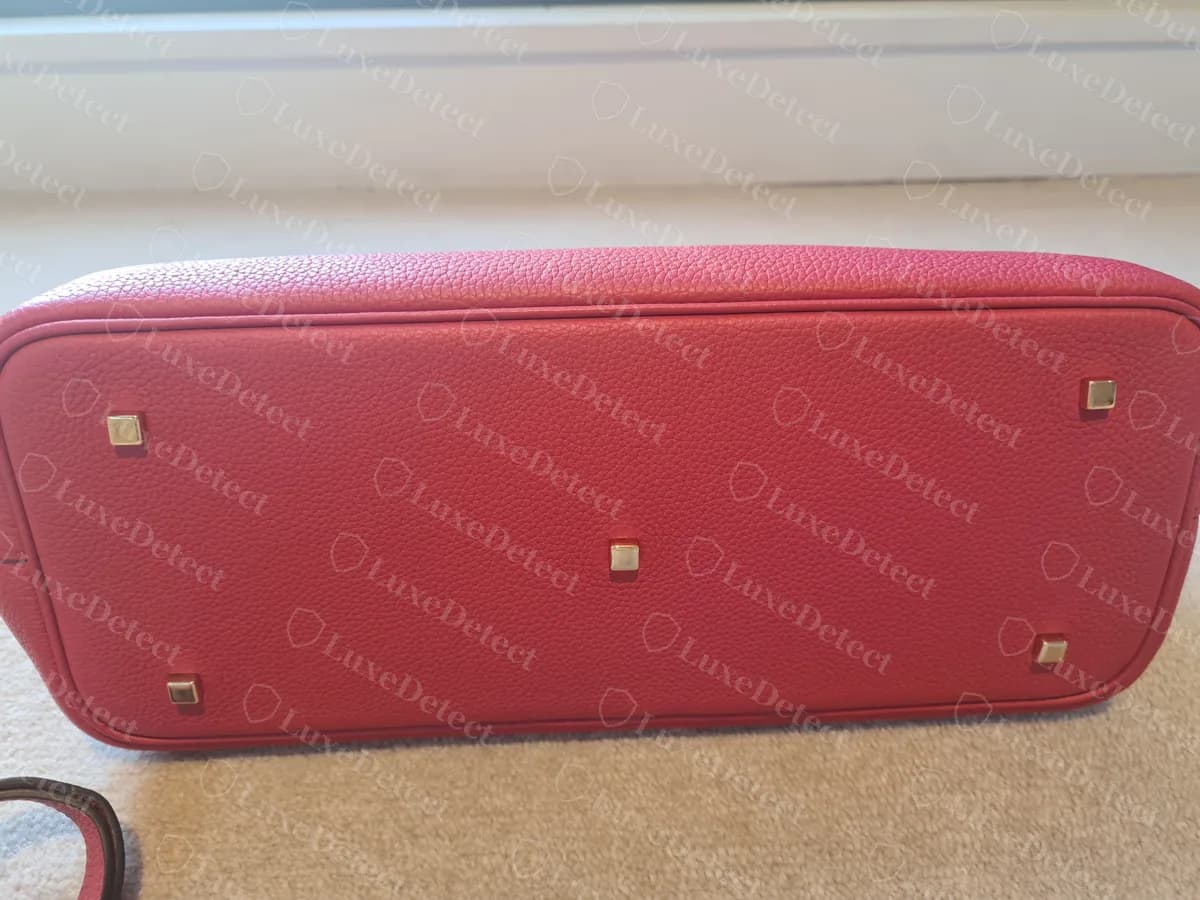Counterfeit Moynat Gabrielle base with five square studs, the same layout as a genuine larger Gabrielle