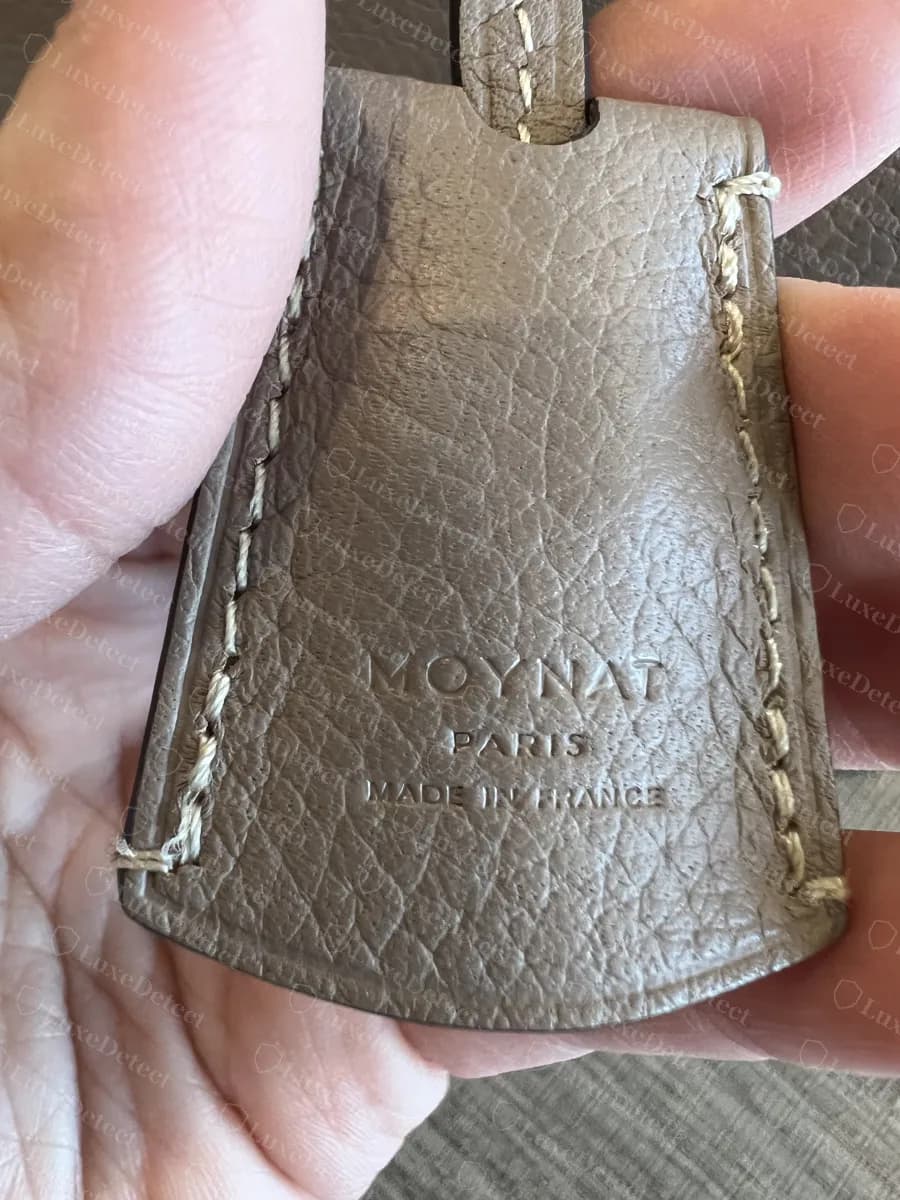 Genuine Moynat key holder stamped MOYNAT PARIS MADE IN FRANCE in small wide capitals