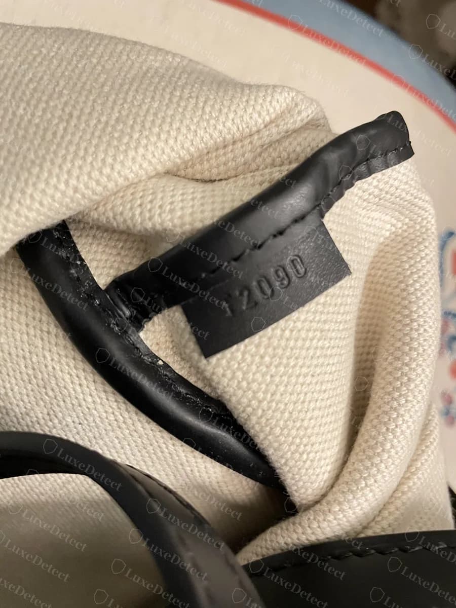 Genuine Moynat Oh! Tote interior leather tab heat-embossed with the code T2090