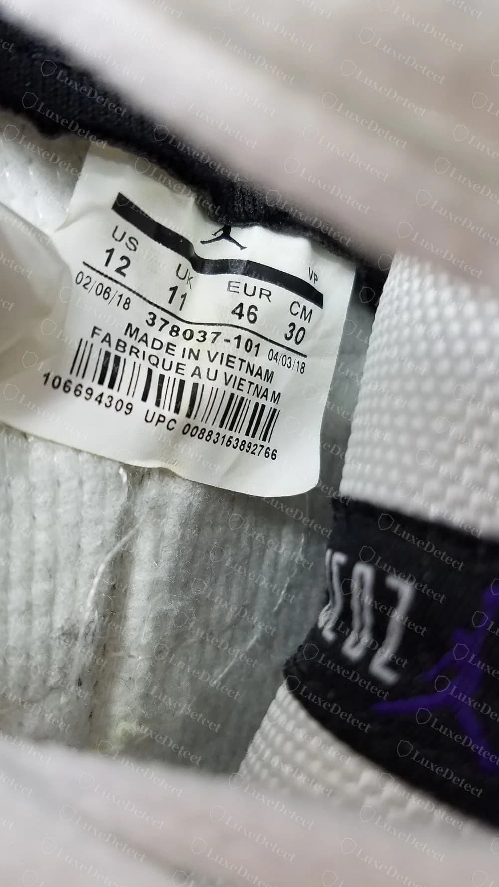 Etichetta falsa della Air Jordan 11 Concord 2018 con 378037-101 e Made in Vietnam, datata febbraio e aprile 2018