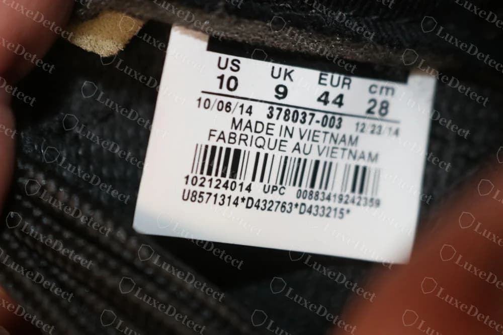 Fake Air Jordan 11 Space Jam label reading 378037-003 and Made in Vietnam, with dates in October and December 2014