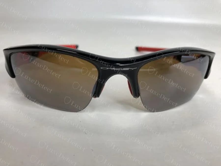Genuine Oakley Flak bridge etch — the OAKLEY wordmark level, evenly spaced, and consistently formed across every letter