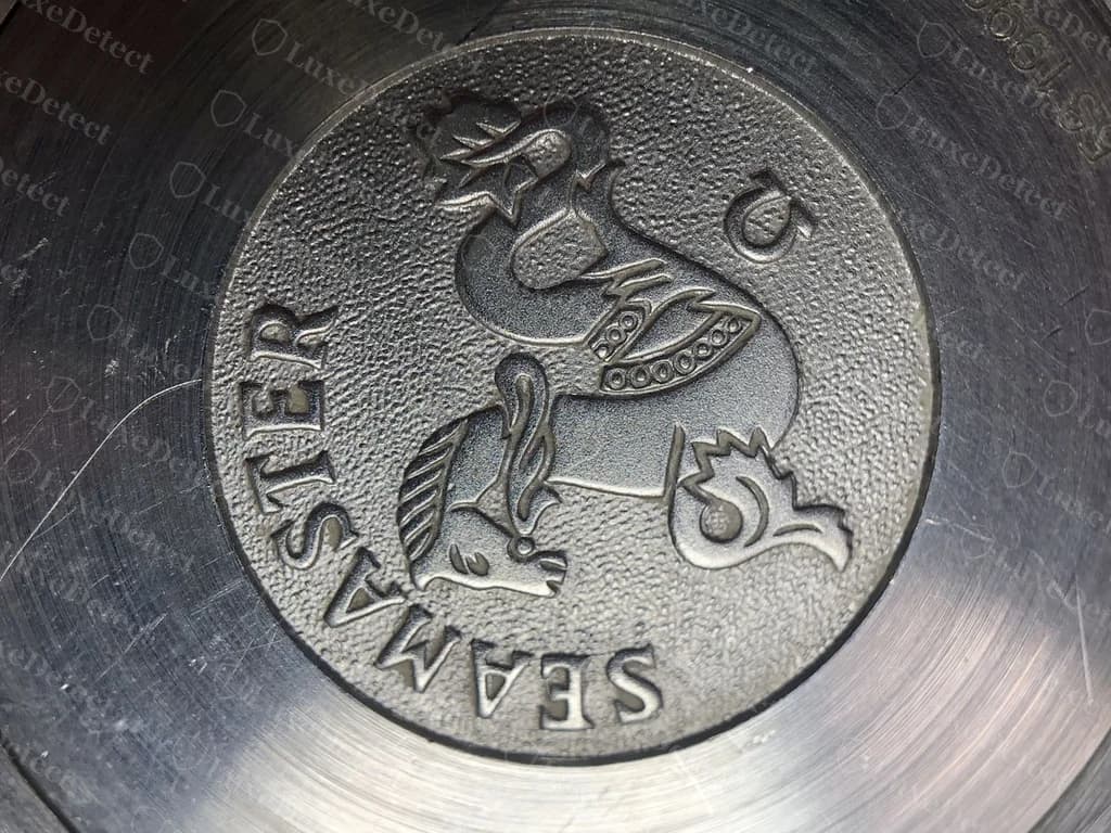 Genuine Omega Seamaster Professional caseback — the Seahorse medallion and "SEAMASTER" lettering struck in fine, textured relief with sharp edges