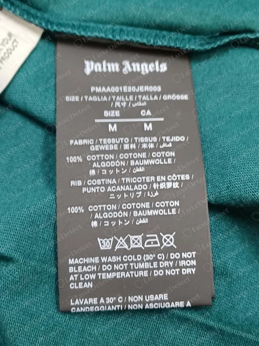Genuine Palm Angels black wash tag with the name at the top, a style code, size shown as SIZE and CA, and cotton fibre lines in several languages