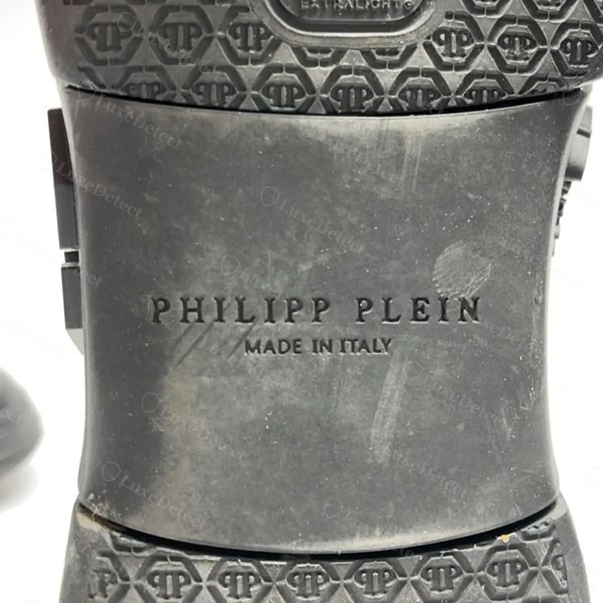 Authentic Philipp Plein sneaker, hexagonal "PP" monogram embossed directly into the leather side panel, no screws or applied hardware
