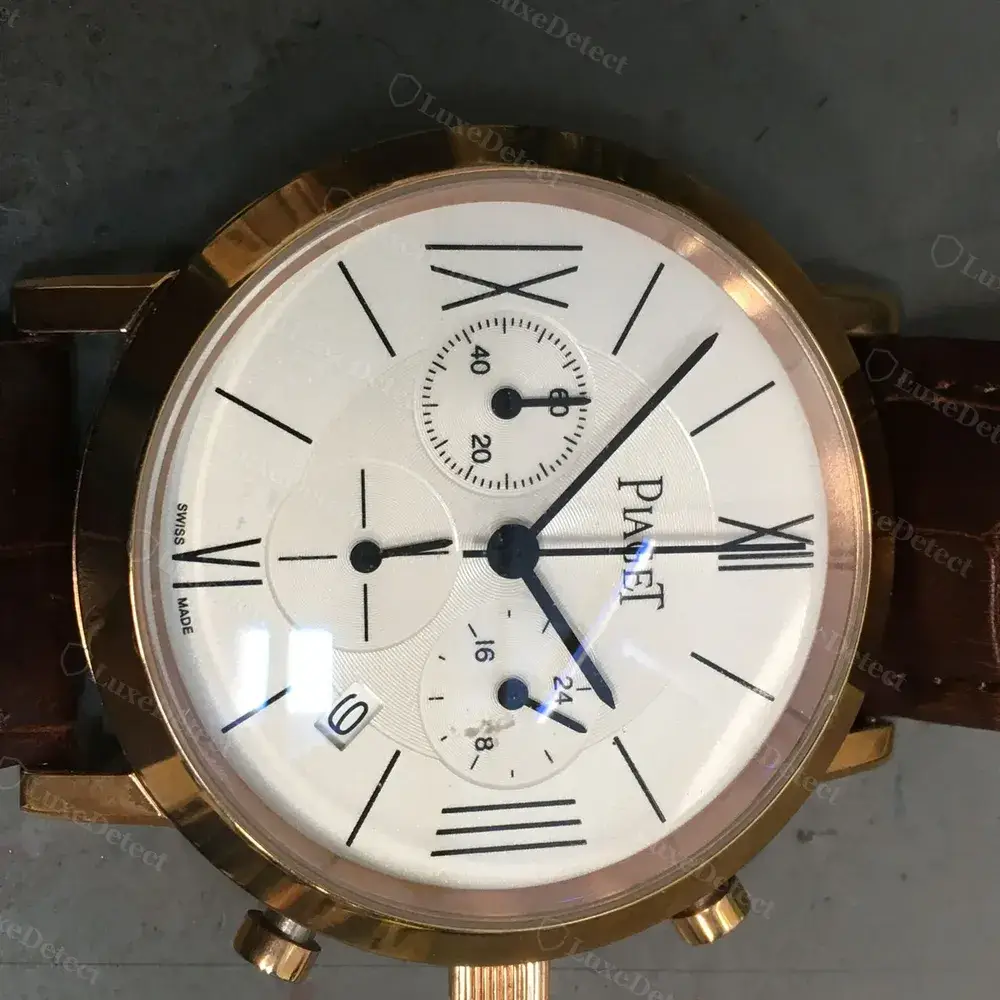 A fake chronograph-style Piaget: the date window shows a flat, cropped, unmagnified digit sitting off-centre, without the sharp oversized print a genuine Piaget date window produces.
