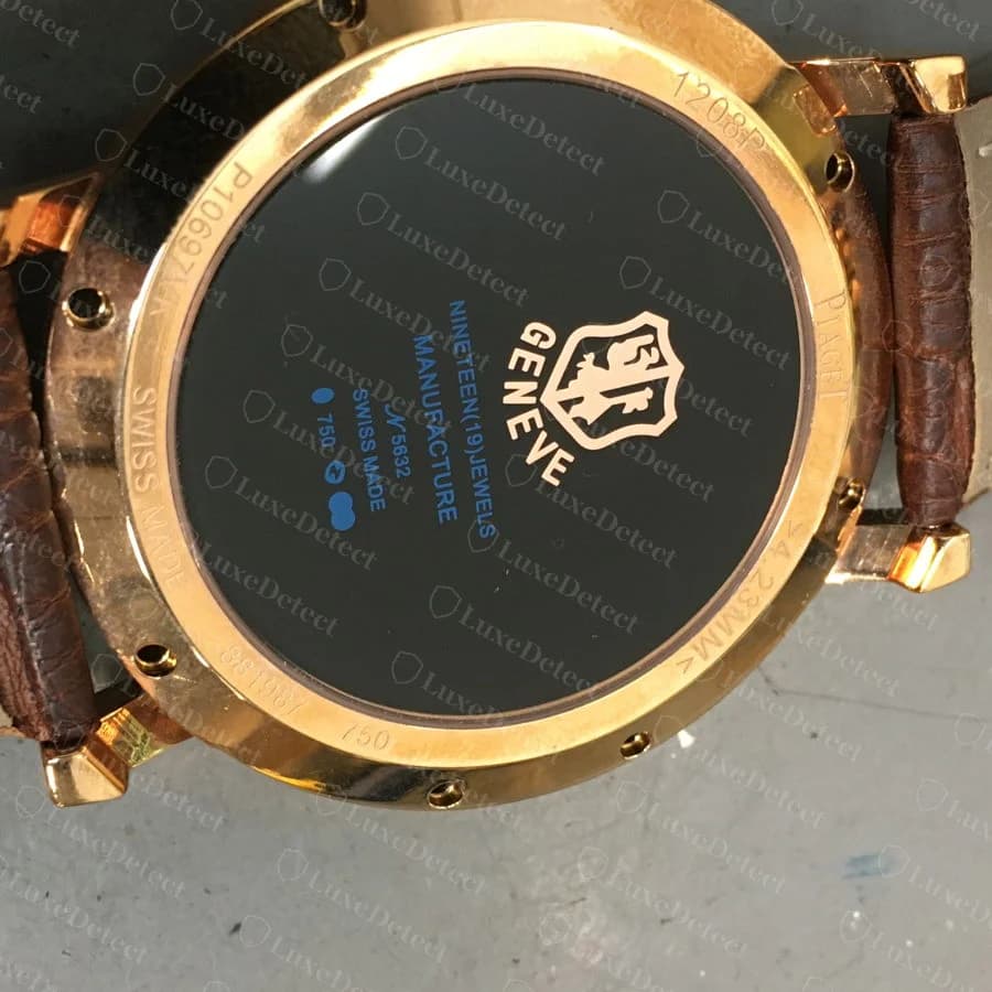 The same fake's caseback, engraved "NINETEEN(19)JEWELS MANUFACTURE... GENEVE... 750 SWISS MADE."
