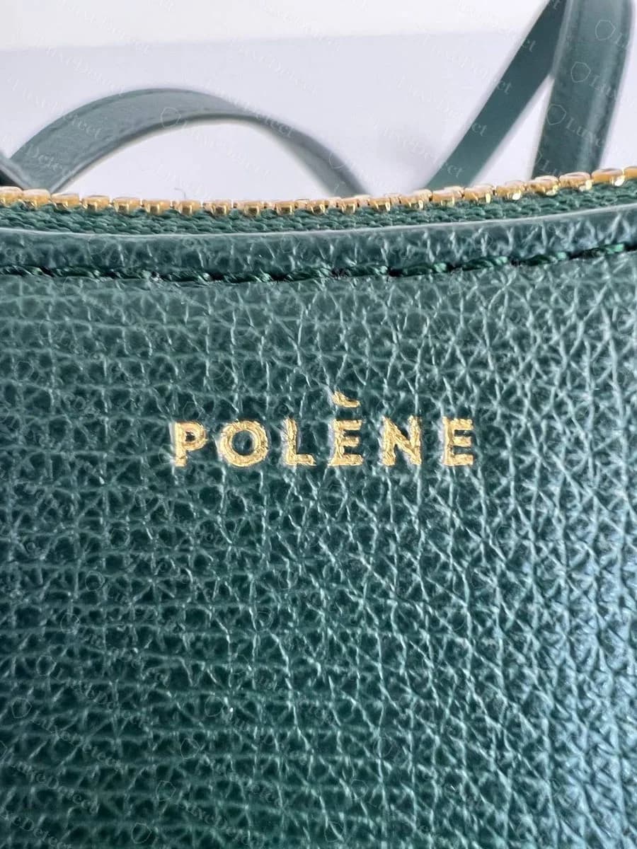Genuine Numéro Dix front stamp: POLÈNE in small, evenly spaced gold capitals on green grained leather