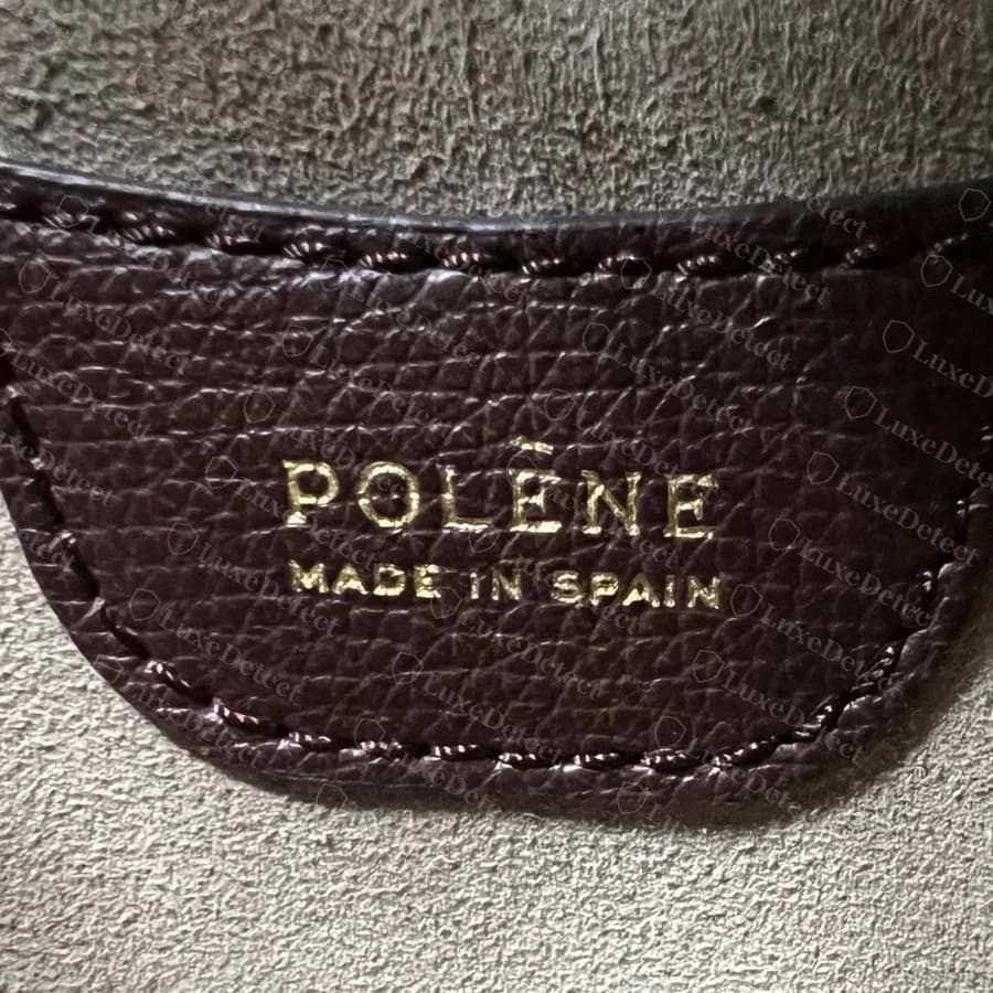 Genuine Numéro Dix interior tab on burgundy leather: POLÈNE over MADE IN SPAIN in small capitals