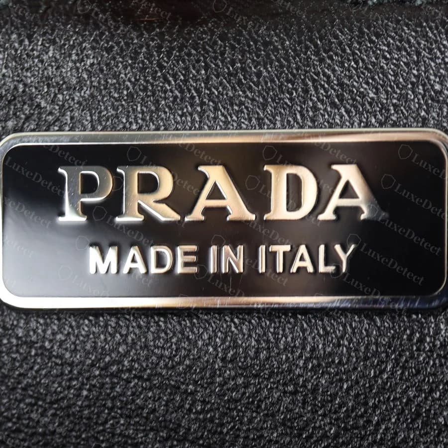 Genuine Cahier size tag reading "25," Prada's internal size code, tucked into the interior seam