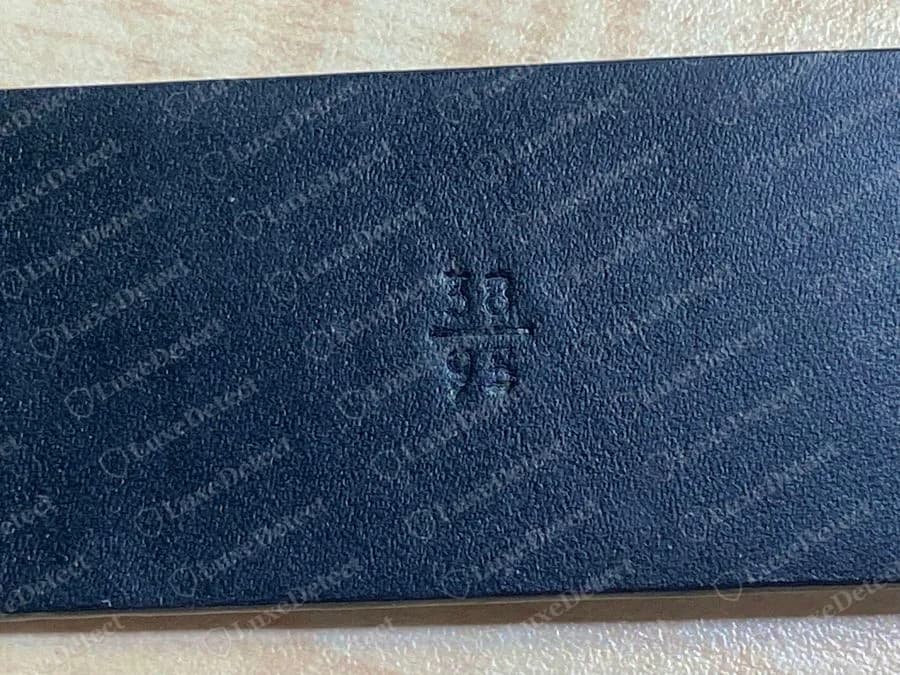 Authentic Prada belt size stamp: 38 over 95, inches above centimetres