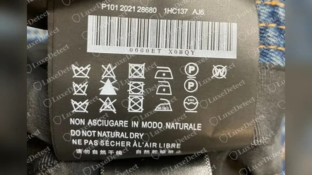 Fake Prada denim bucket hat label copying the genuine format: P101 2021 28680, 1HC137 and AJ6 above a barcode, care symbols and DO NOT NATURAL DRY