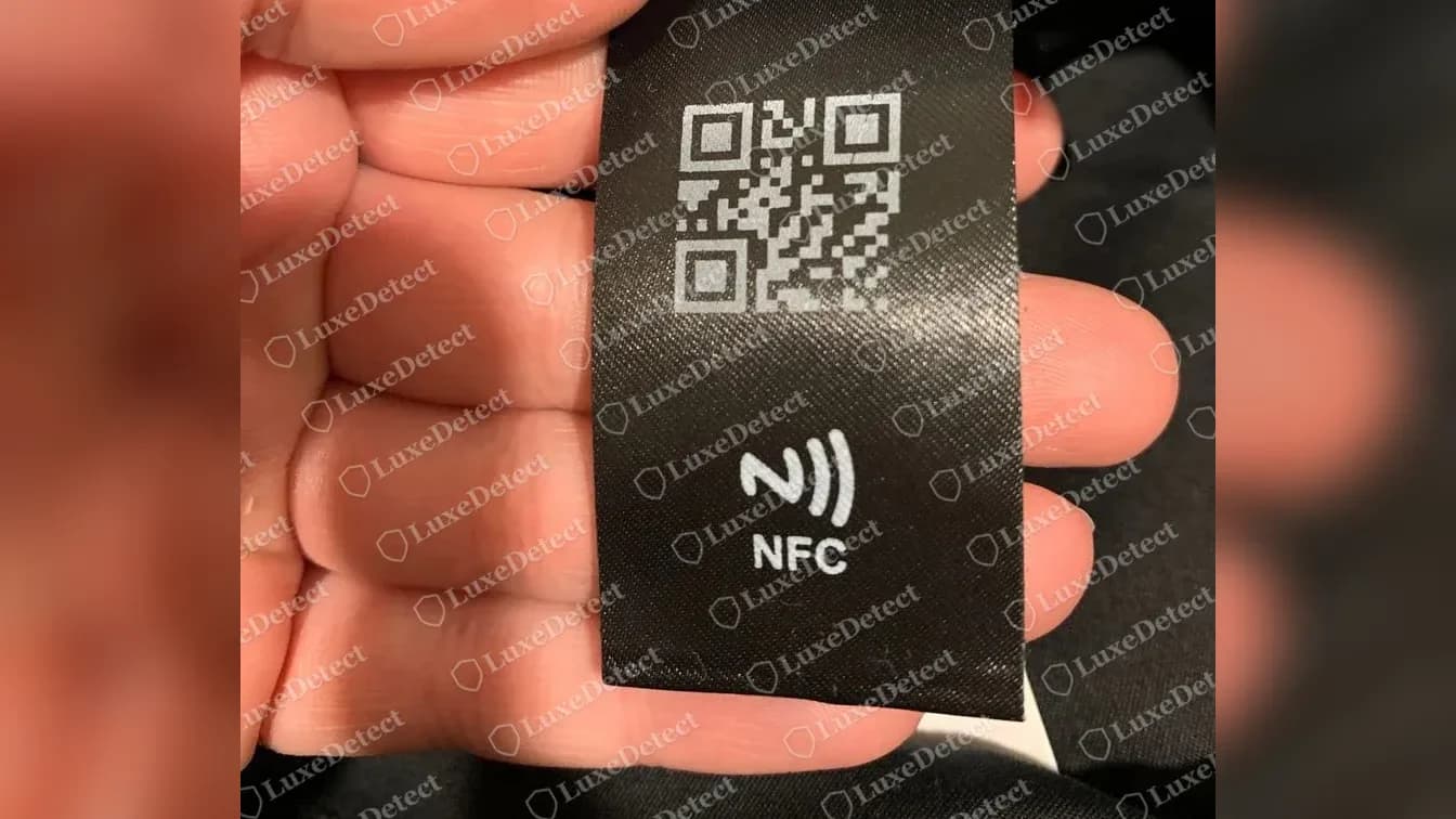 Genuine Prada bucket hat QR code and NFC tag hanging below the care label