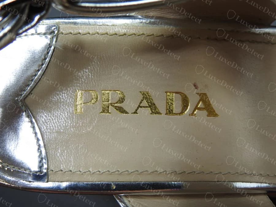 Genuine silver espadrille wedge insole, gold-foil "PRADA" stamp with "Made in Italy" and the size below, no additional text or crest