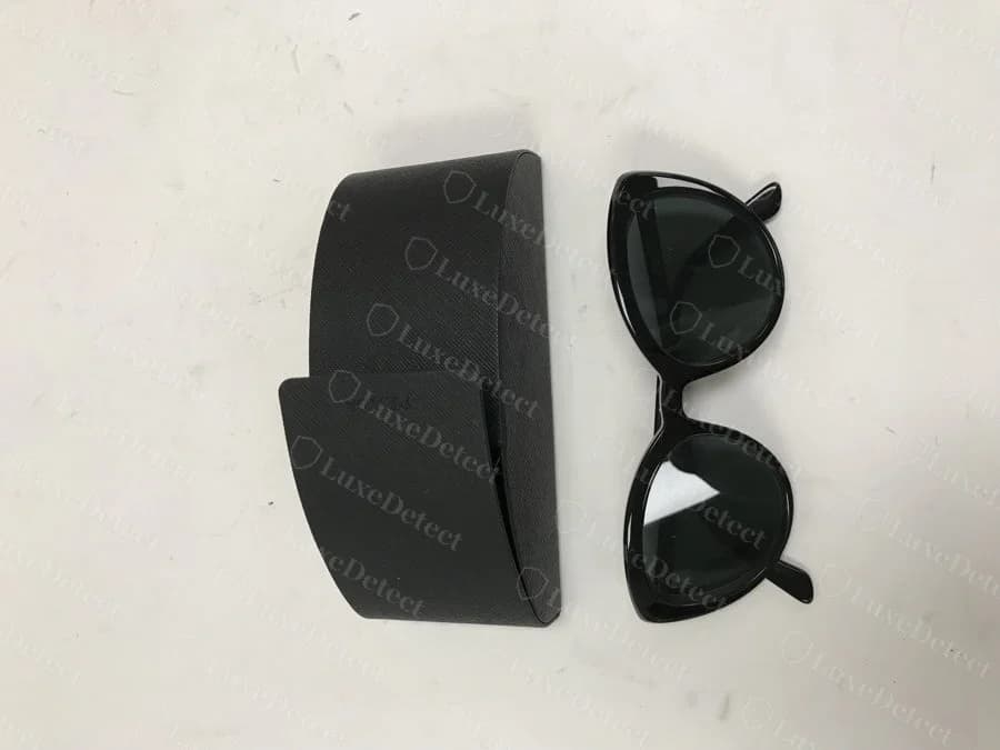 A counterfeit Prada case, left, next to the sunglasses it was sold with.