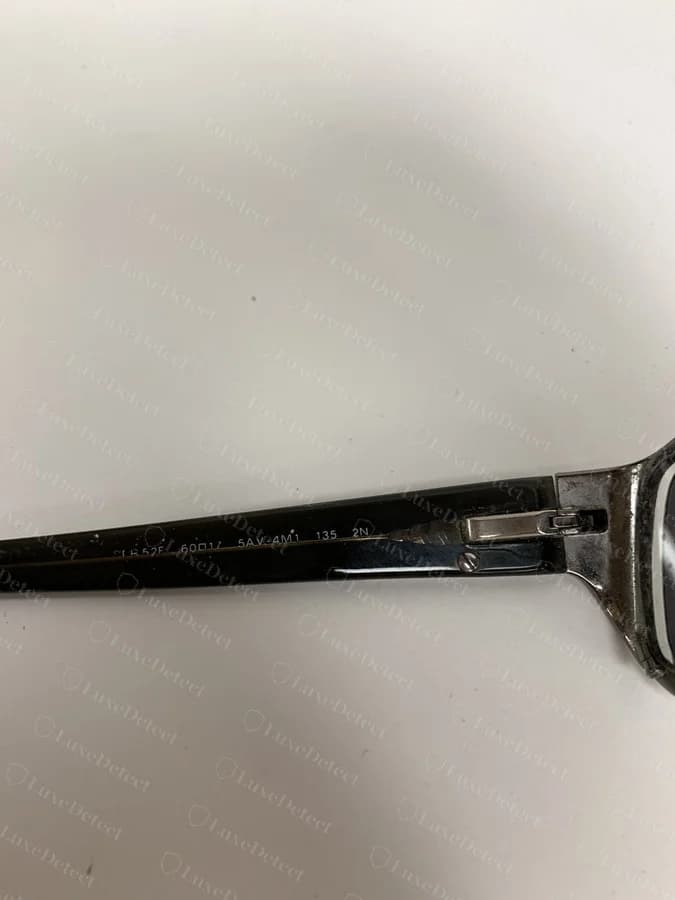 A fake hinge showing rough, uneven striations along the cut edge of the barrel.