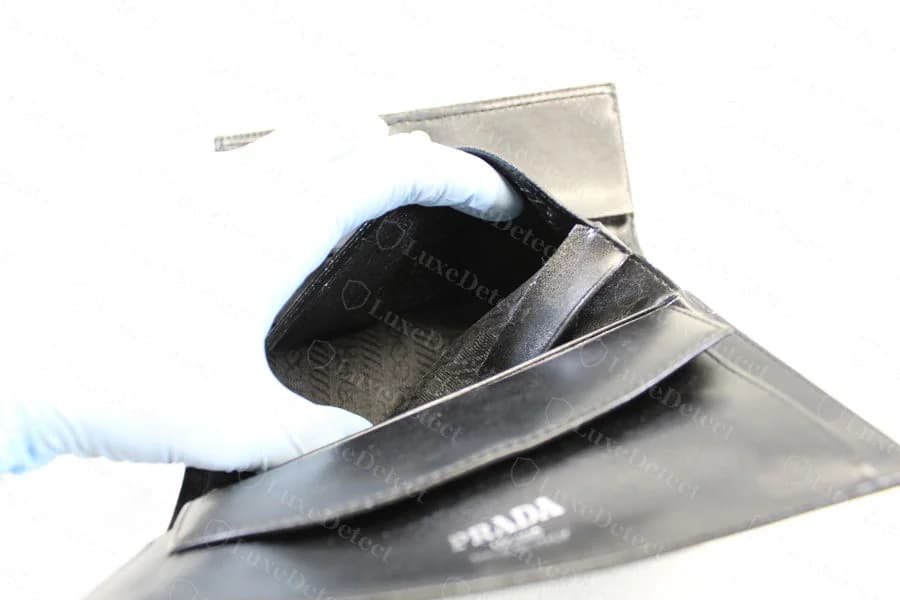 Prada wallet interior construction, a counterfeit that otherwise looks clean at this angle — card slot checks alone don't distinguish this piece