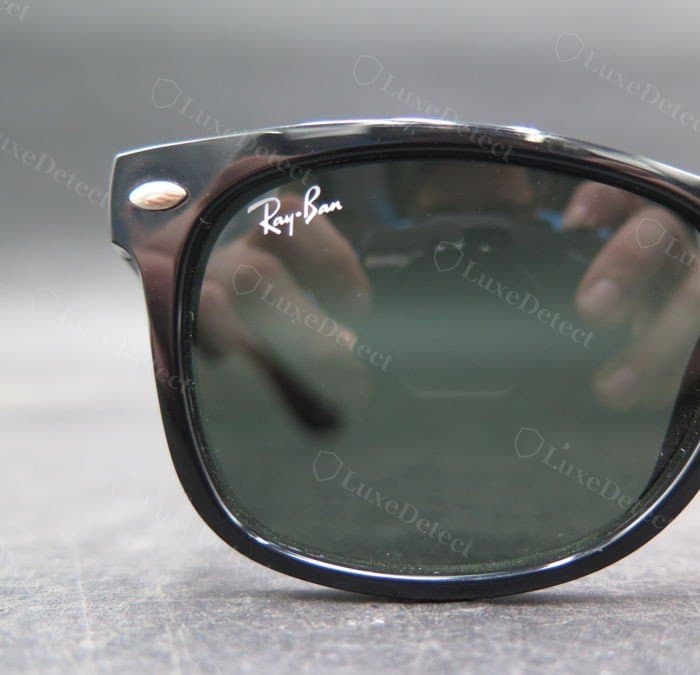 Authentic Ray-Ban script etched cleanly on the lens, sharp white lettering with no bleed