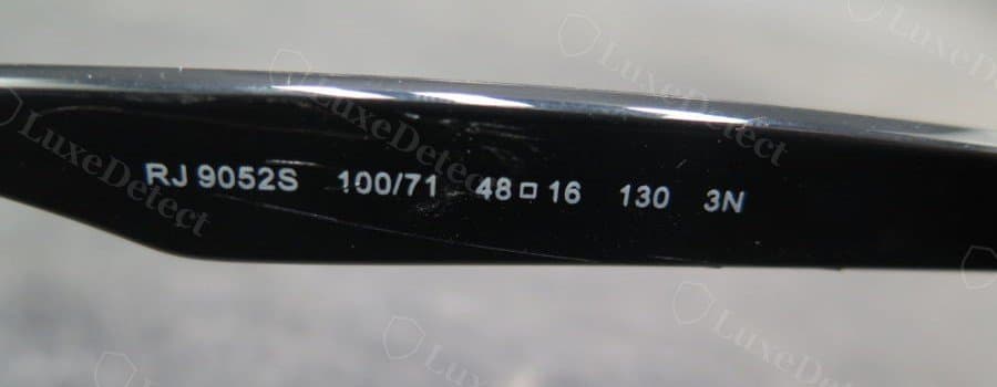 Authentic temple engraving: RJ9052S model code, crisp and evenly spaced, each character reads sharply