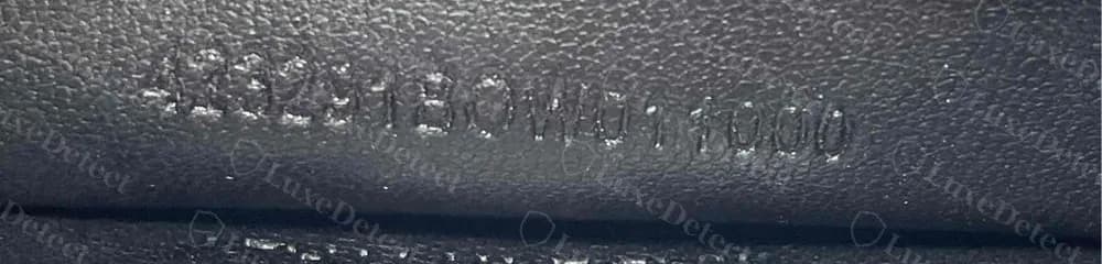 Counterfeit Cassandre card holder: the stamp is the long retail article code (note the BOW01 block), copied from the tag rather than the letter-prefixed production code