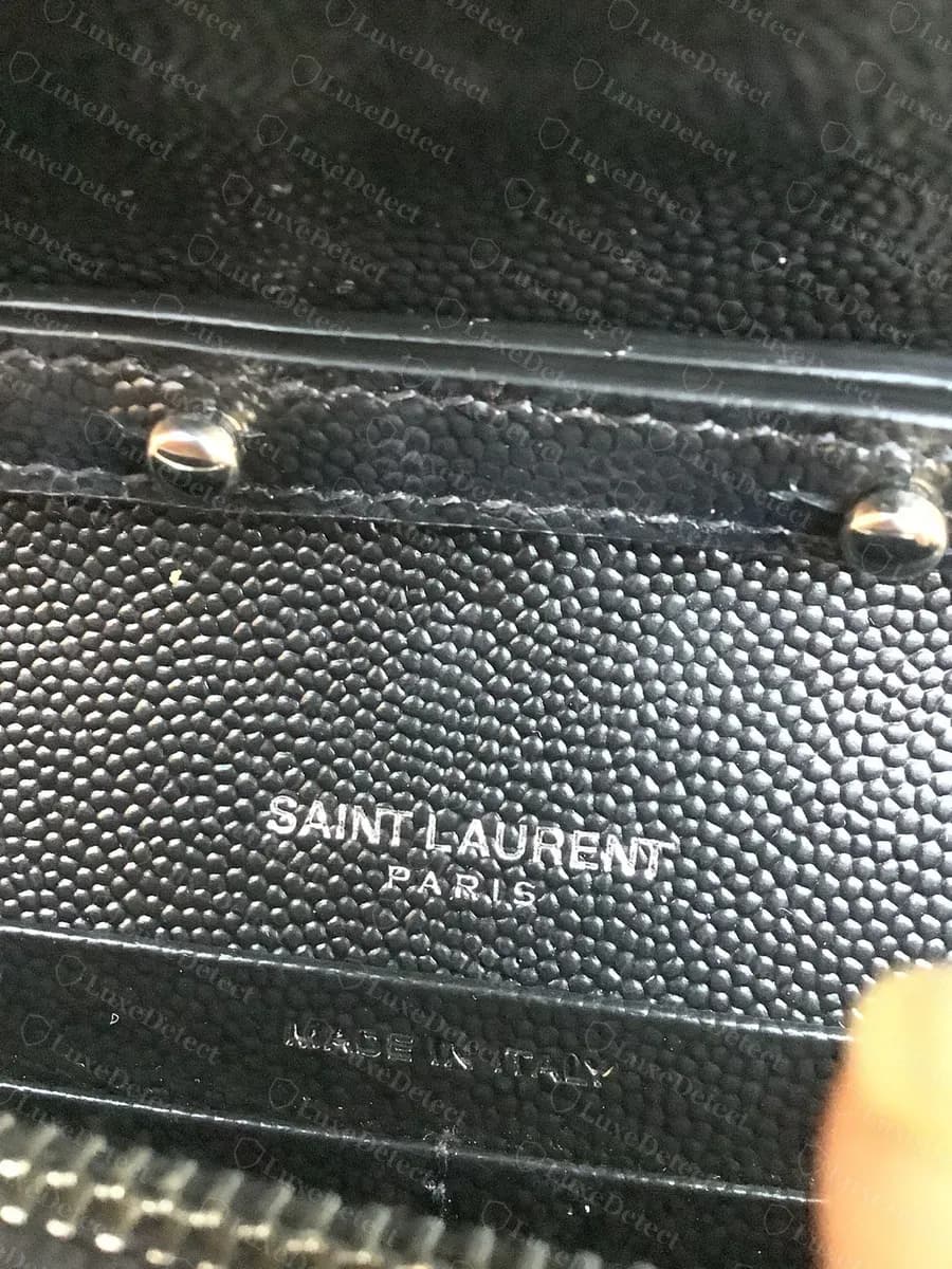 Genuine interior stamp reading SAINT LAURENT PARIS with a separate MADE IN ITALY stamp, evenly pressed into the interior leather