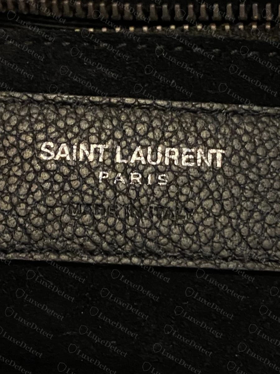 Genuine interior stamp, "SAINT LAURENT PARIS MADE IN ITALY" on matching grained leather.